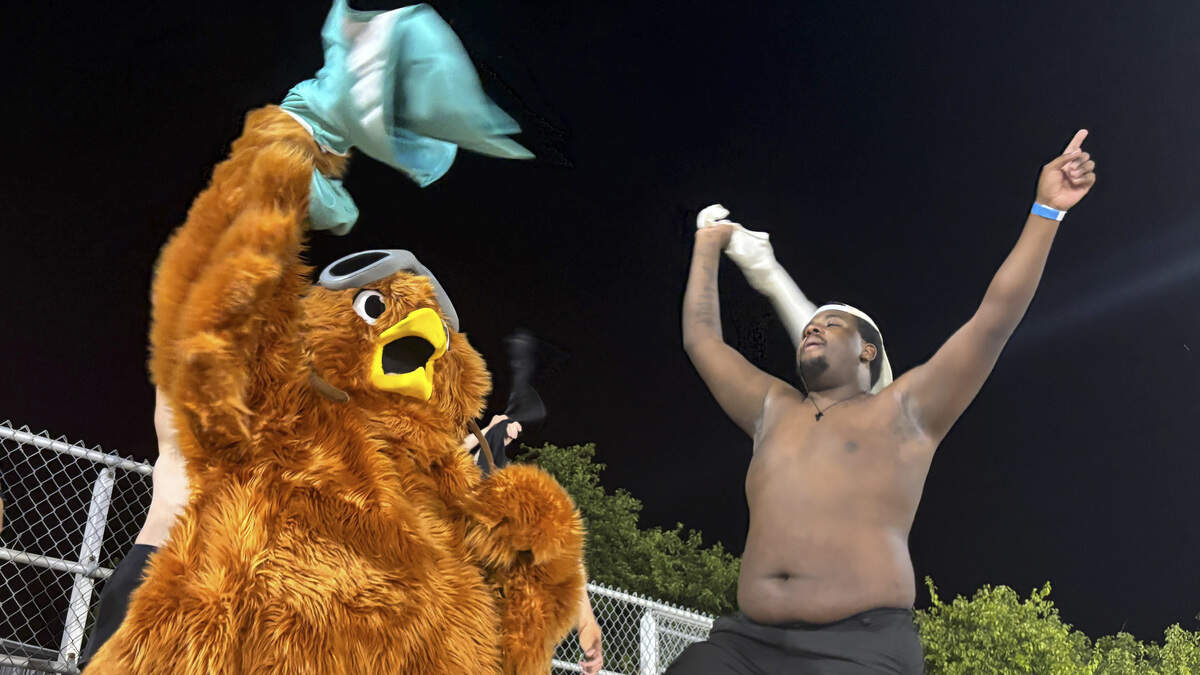 Willy the Wild Chicken, the Yuba-Sutter Freebirds mascot celebrates with fans during a game at Bryant Field in Marysville on Tuesday, June 23, 2026. The Freebirds are offering deals on beer, tickets and hot dogs, every Tuesday.