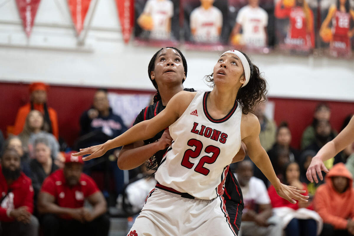 The McClatchy Lions’ Nina Cain (22) blocks out the Antelope Titans’ Brianna Walker (24) in the second half of a CIF Sac-Joaquin Section Division I playoff game Thursday in Sacramento.