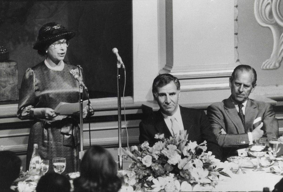 Queen Elizabeth II speaks at a luncheon gathering at the state Capitol as Gov. George Deukmejian and Prince Phillip listen on March 4, 1983.