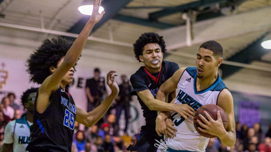 Sheldon center Chris Wriedt (23) battles Folsom's Martis Johnson  and Mason Forbes (25) for a rebound in a Sac-Joaquin Section Division I semifinal on Feb. 28.
