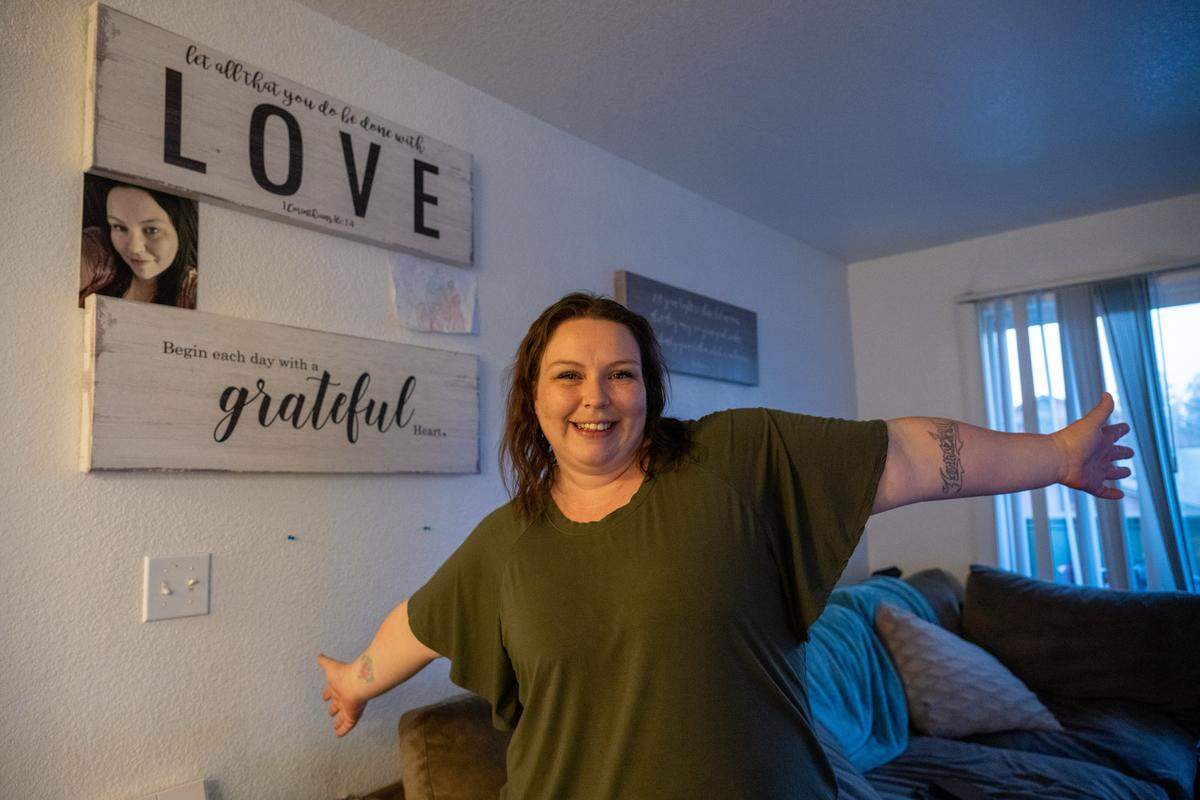 Katie Horton, 34, stands in her two-bedroom Lincoln apartment on Wednesday, Jan. 29, 2025. Formerly homeless, she said the Placer County Family Self-Sufficiency Program is helping her build a strong financial foundation. “It took me coming to Placer County to really find the resources and people who care,” she said. 