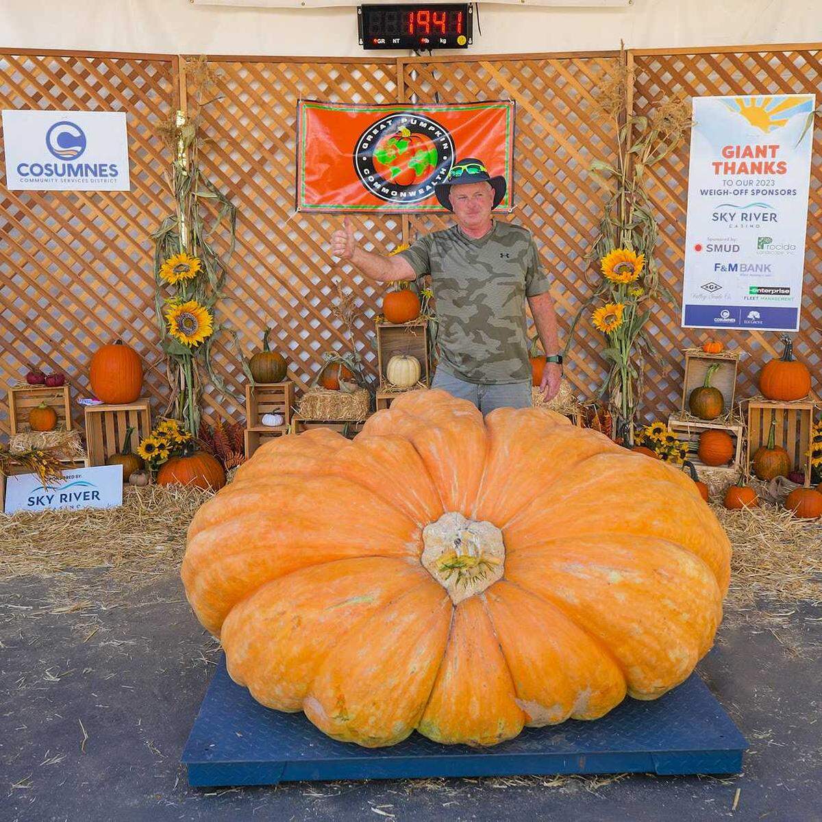 Russ Pugh with his 1,941-pound winning pumpkin at the Elk Grove Giant Pumpkin Festival on Saturday, Oct. 7, 2023.