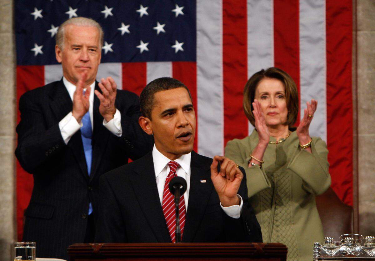 Vice President Joe Biden and House Speaker Nancy Pelosi of California applaud as President Barack Obama addresses a joint session of Congress in the House Chamber of the Capitol in Washington on Feb. 24, 2009.