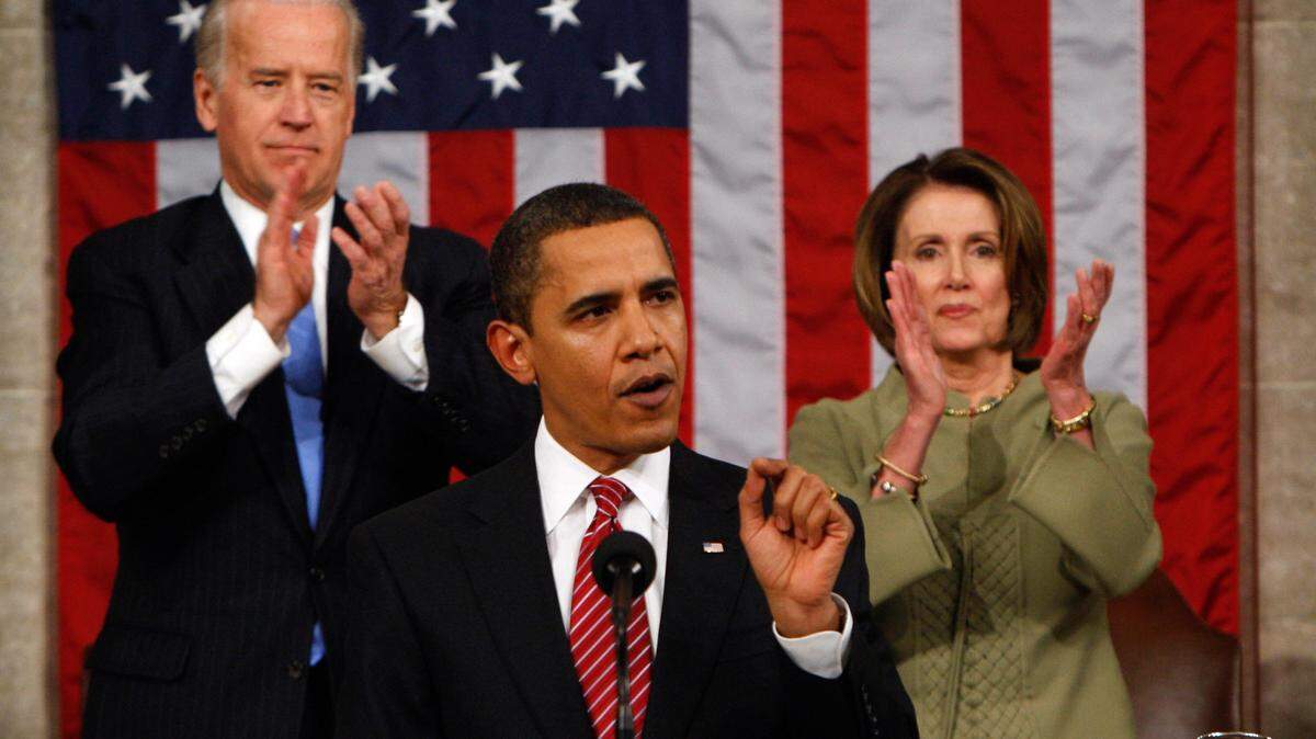 Vice President Joe Biden and House Speaker Nancy Pelosi of California applaud as President Barack Obama addresses a joint session of Congress in the House Chamber of the Capitol in Washington on Feb. 24, 2009.