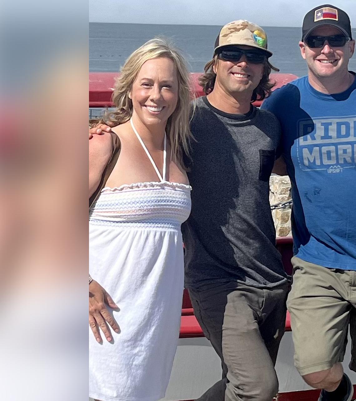 From left, Aimee Johns, Heath Braddock and Paul Bandy pose for a picture after they rescued a man attacked by a shark at Lovers Point Beach in Pacific Grove, Calif., on Wednesday, June 22, 2022. Johns and Bandy, a nurse and a police officer who live in the Sacramento area, were celebrating their 12th wedding anniversary when the attack happened.