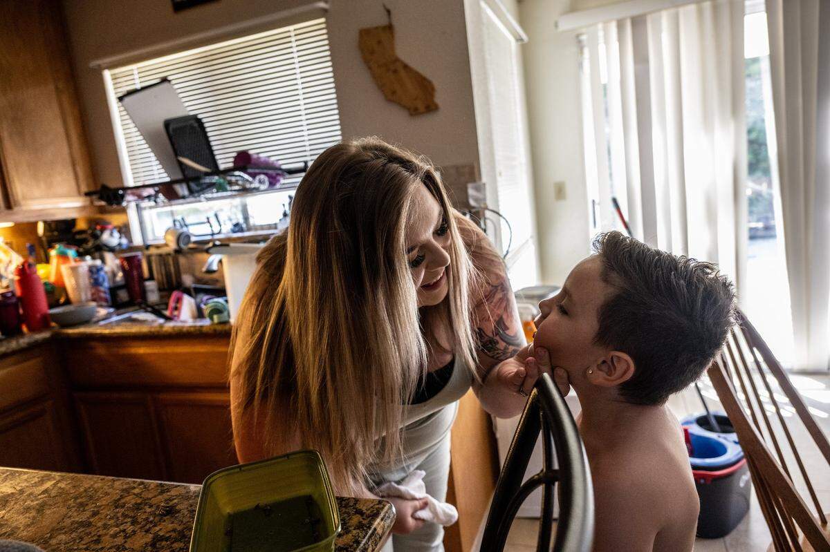Kaitlyn Weiss inspects her 6-year old son Beau Weiss’s face after wiping it clean at their home in Modesto earlier this month. Beau was a vaginal birth after cesarean, or VBAC. While a VBAC birth slightly increases the risk of uterine rupture, a serious birth complication, each C-section further increases the risk of bad birth outcomes, including future infertility and maternal death.