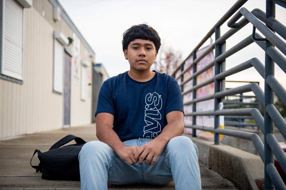 Jorge Chavez sit on the steps of Capitol City School in South Sacramento, Thursday, Dec. 5, 2019, while recounting his experience with SRO officers after a fight with another student.