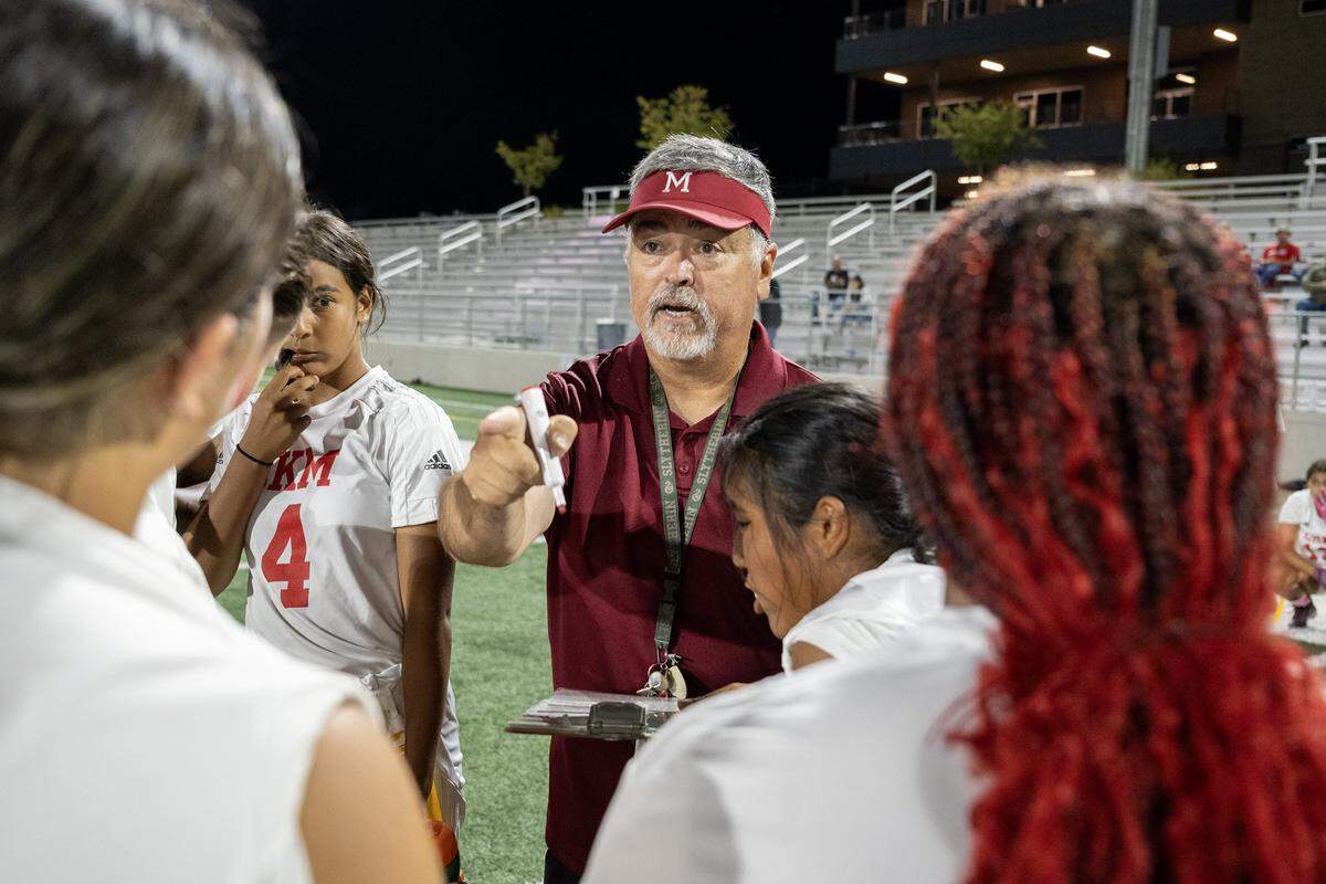 McClatchy flag football coach John Avery speaks to his team during a timeout during their game against the West Park Panthers in October.
