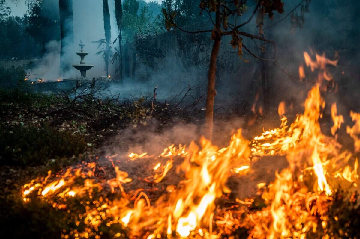 The Glass fire burns near a home in Calistoga on Monday.