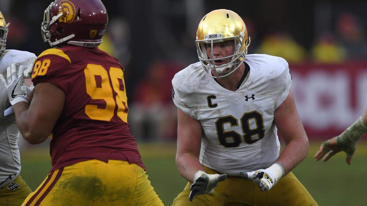 File-This Nov. 26, 2016, file photo shows Notre Dame offensive lineman Mike McGlinchey, left, blocking Southern California defensive tackle Josh Fatu during the second half of an NCAA college football game in Los Angeles. McGlinchey was named to the second team AP Preseason All-America Team on Tuesday, Aug. 22, 2017.