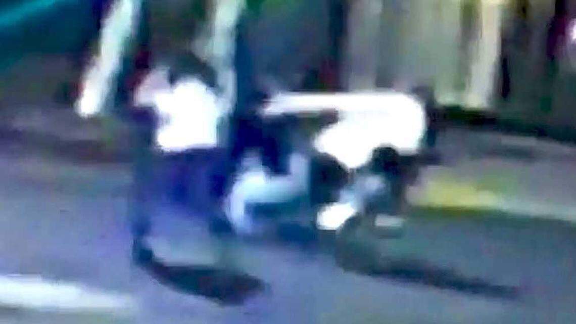 In this cropped screen capture of a surveillance video pointed at 21st and K streets in midtown Sacramento early Thursday, Oct. 8, 2015, Spencer Stone, believed to be the man in a white shirt jutting to the right in this frame, is seen fighting two unknown men. Stone was stabbed in the incident and hospitalized.