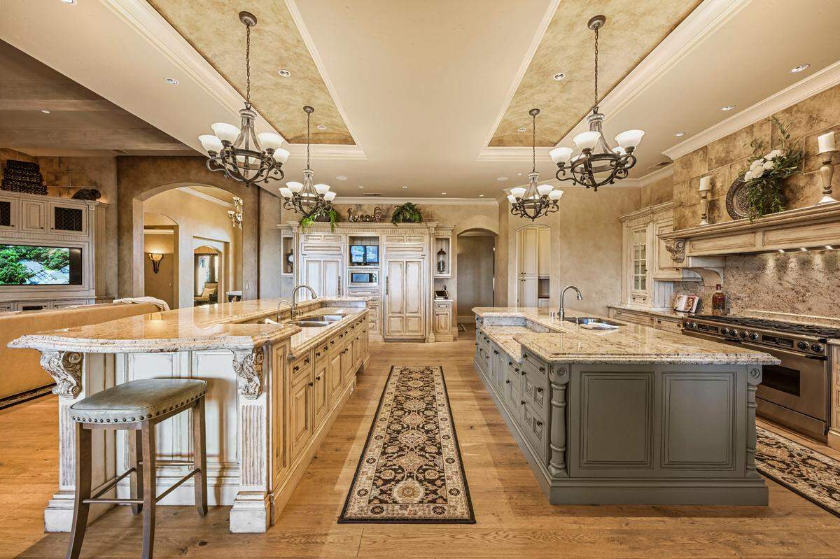 The gourmet kitchen has dual islands.
