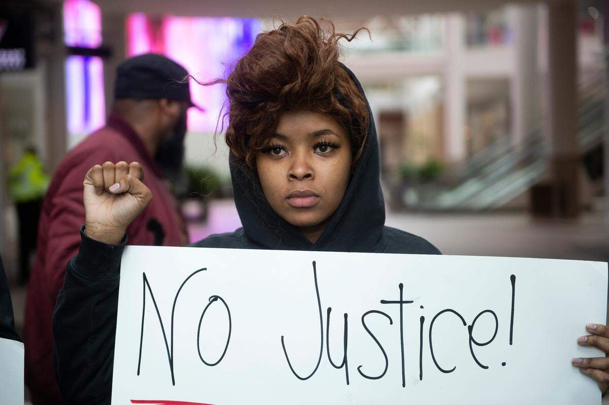 Dominique Harrell stands in solidarity with Stephon Clark protesters after they shut down the Arden Fair Mall in Sacramento Calif. during an overnight sit-in Sunday, March 3, 2019, following the Sacramento District Attorney’s decision not to arrest officers involved in last year’s shooting of the unarmed black man.