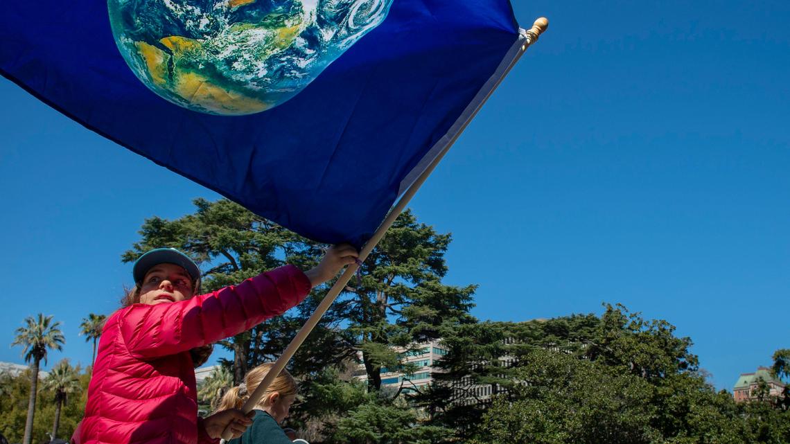 Viola Palladini joins with other young activists to protest the government’s failure to take action to stop climate change, Friday, March 15, 2019, at the Capitol.