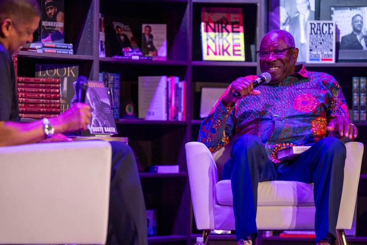 Former Sacramento Mayor Kevin Johnson, left, speaks with Dusty Baker about Baker’s memoir "Crossroads" during an event at The Guild Theater in Sacramento on Monday.