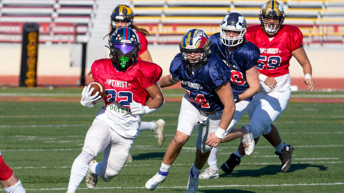 Jervin Navarro breaks free for a South touchdown, one of two on the day for the Monterey Trail senior whose team beat the North 38-9 in the 63rd Optimist All-Star game.