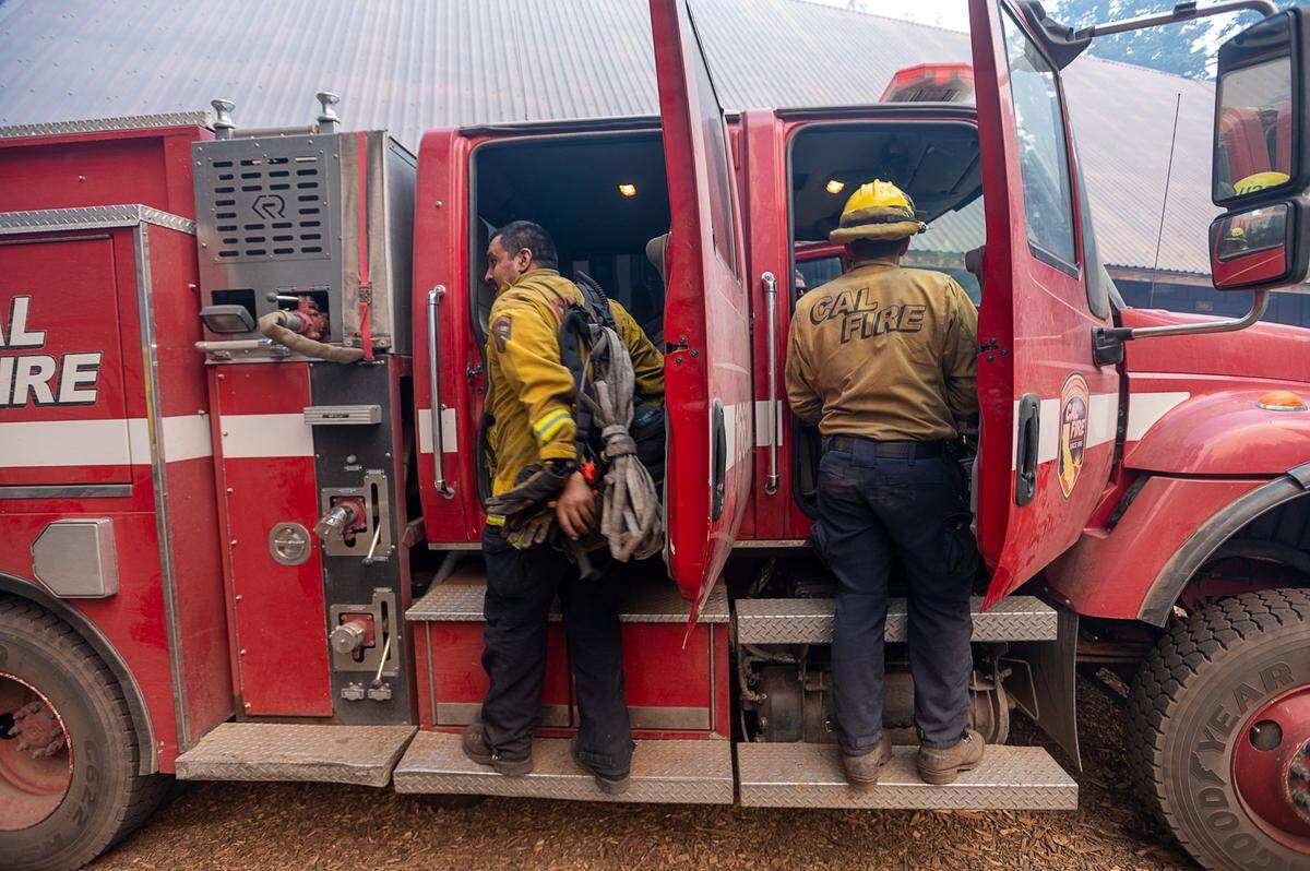 Cal Fire crews from Santa Clara worked through the night to protect Camp Sacramento during the Caldor Fire last August in the Eldorado National Forest. The Department of Forestry and Fire Protection paid $247 million in overtime in 2021.