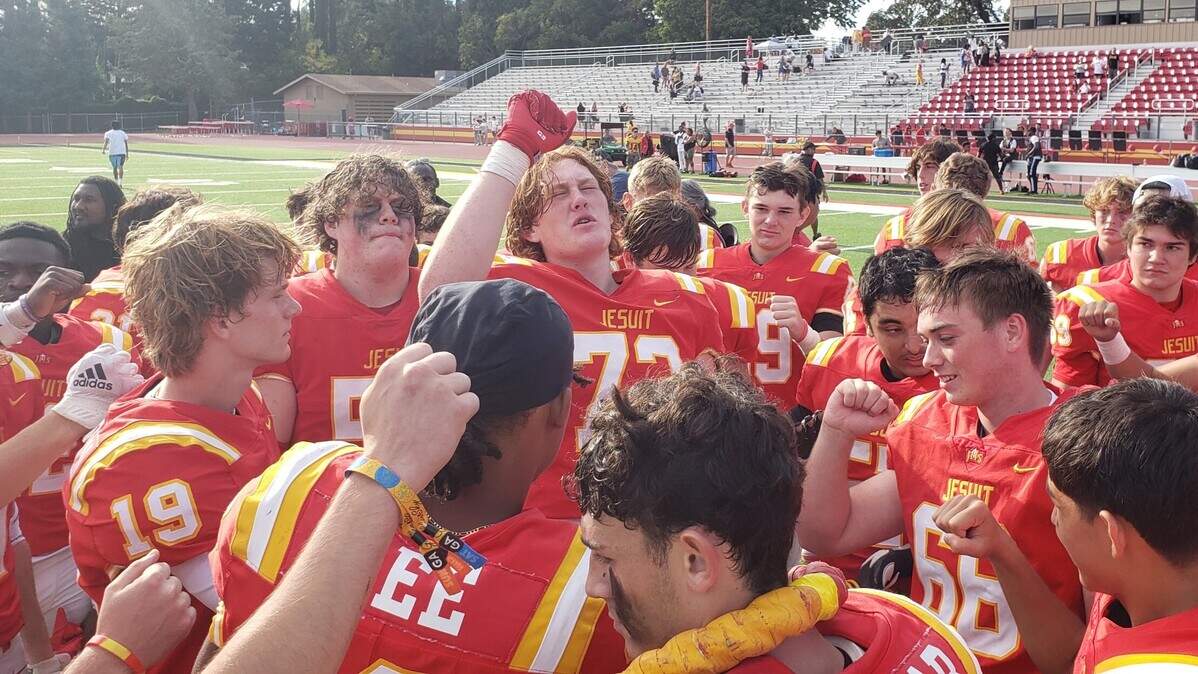 The Jesuit football team celebrates a 28-8 victory over Elk Grove on Saturday, Oct. 21, 2023, at Jesuit High School in Carmichael.