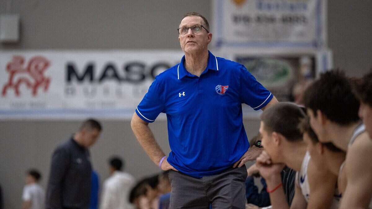 Folsom Bulldogs boys basketball coach Mike Wall, looks up at the game clock in the first half against the Oak Ridge Trojans on Friday, Jan. 23, in Folsom. The Bulldogs defeated the Franklin Wildcats on Thursday to advance to the CIF Northern California Regional semifinal round Saturday against Dougherty Valley.