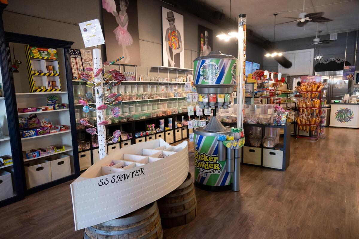 A boat named the S.S. Sawyer holds saltwater taffy at Sawyer’s Sweet Spot in Woodland.. The store plays a video on a loop of Sawyer in happier days and during his battle with cancer.