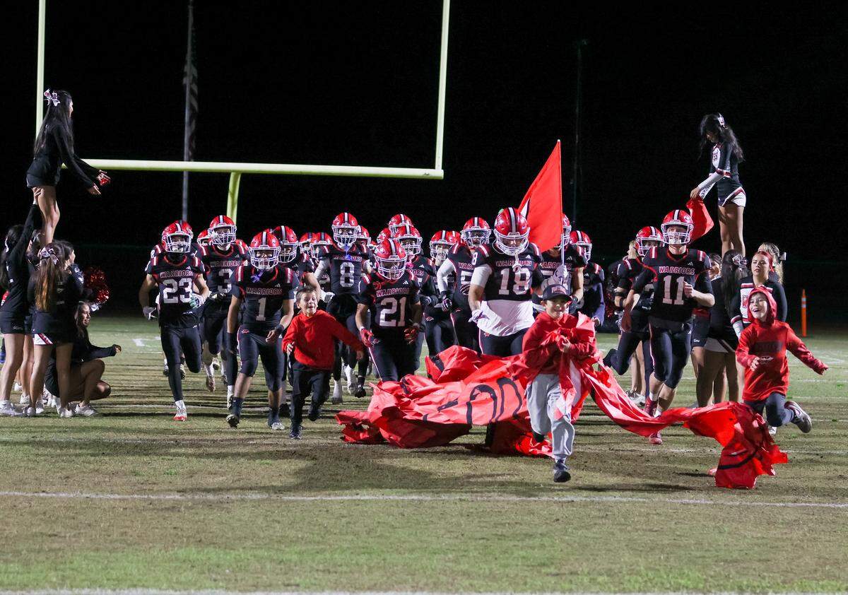 The Winters High School ball boys that take the field include coach Daniel Ward’s sons, Declan on the left and Kellen on the right.