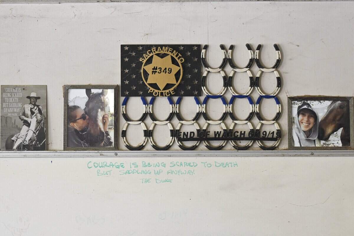 A memorial to Sacramento Police Officer Tara O'Sullivan adorns the wall of the department’s Mounted Unit barn. O’Sullivan, who was not a member of the unit but volunteered with it, was killed while responding to a domestic violence call in 2019.