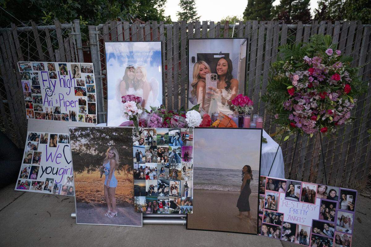 Photos of Ariyonna Orozco, 16, and Piper Conkling, 14, who died in the fiery crash near Rancho Murieta, are displayed at a candlelight vigil at North Laguna Creek Park in Sacramento on Friday.