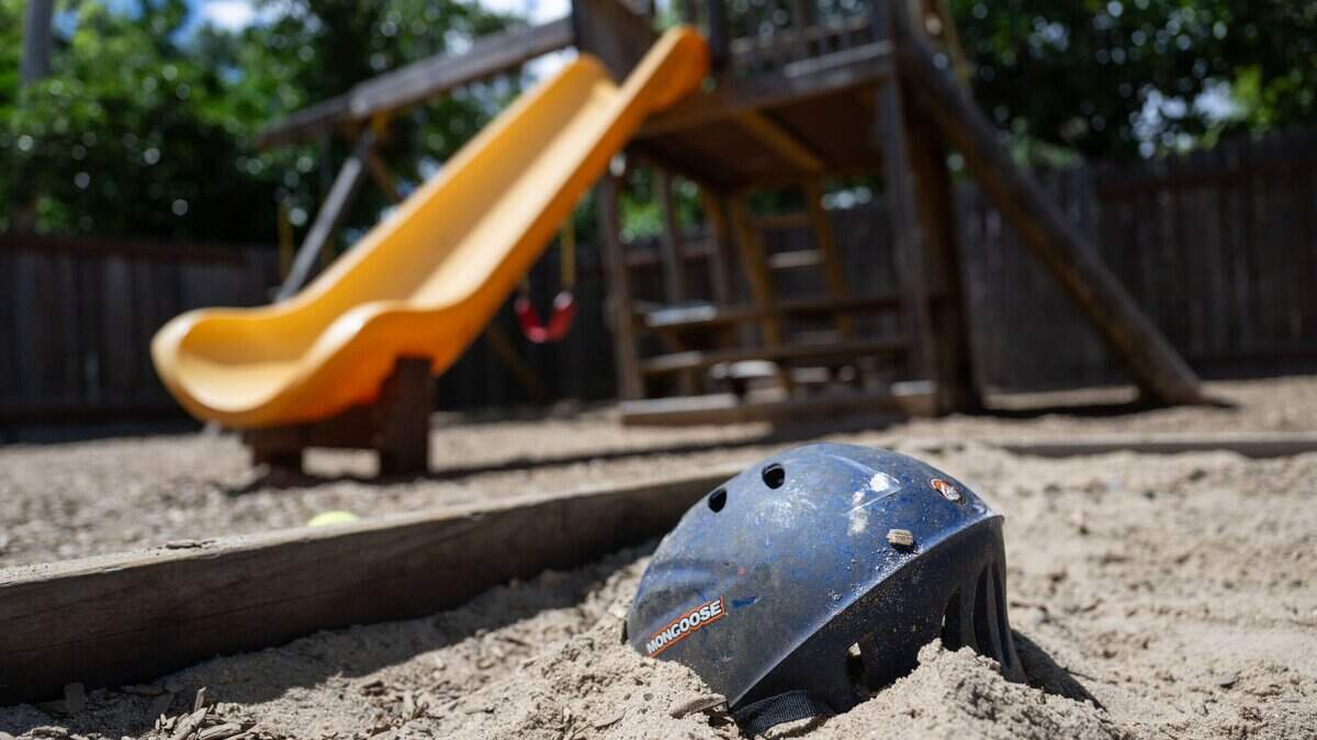 A bicycle helmet lies in a sandbox on Friday, April 26, 2024, at Progress Ranch, a Davis short-term residential therapeutic facility for boys ages 6-13 who need full-time care.