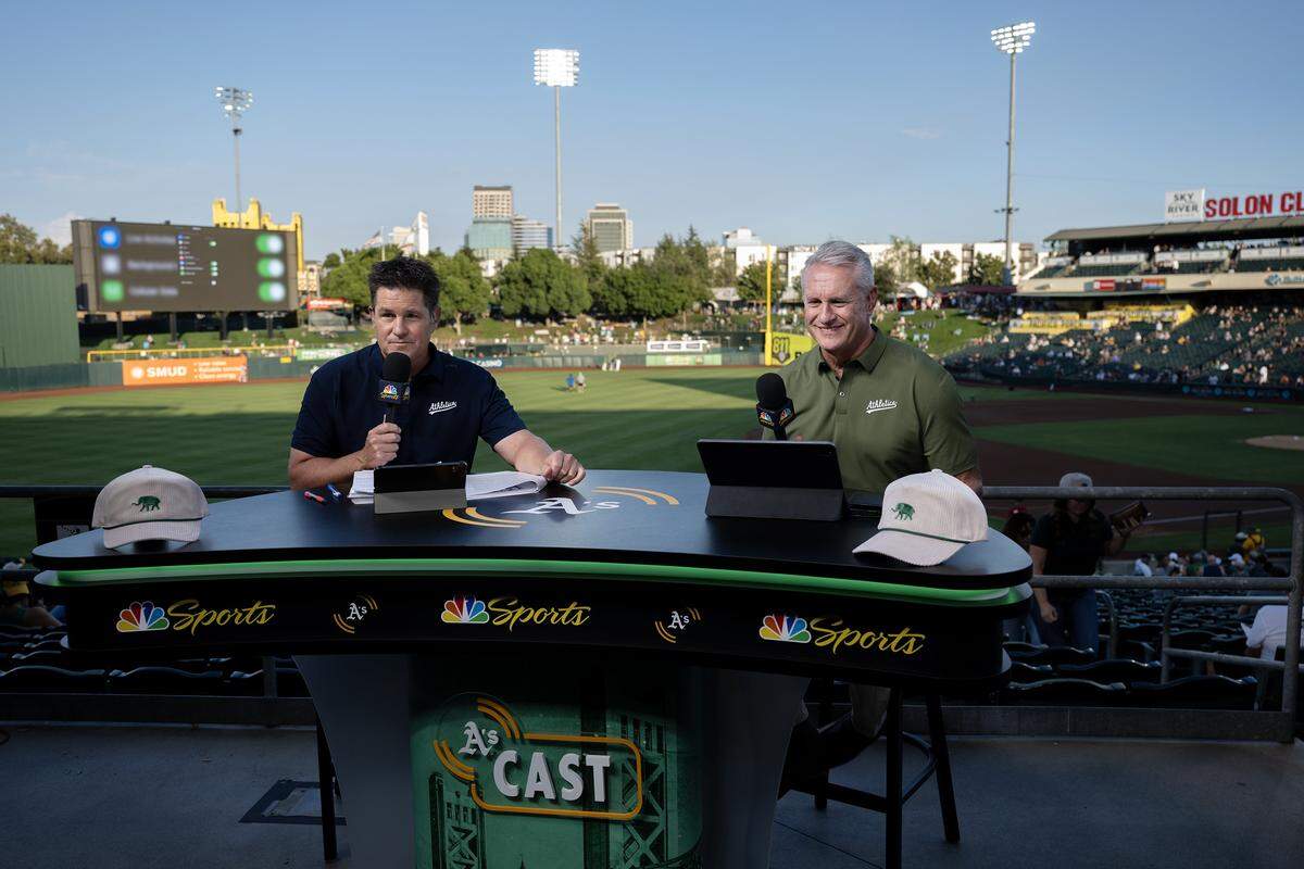 Athletics pregame show broadcasters Steve Sax, right, and Chris Townsend talk before the team faces the Detroit Tigers last month at Sutter Health Park in West Sacramento.