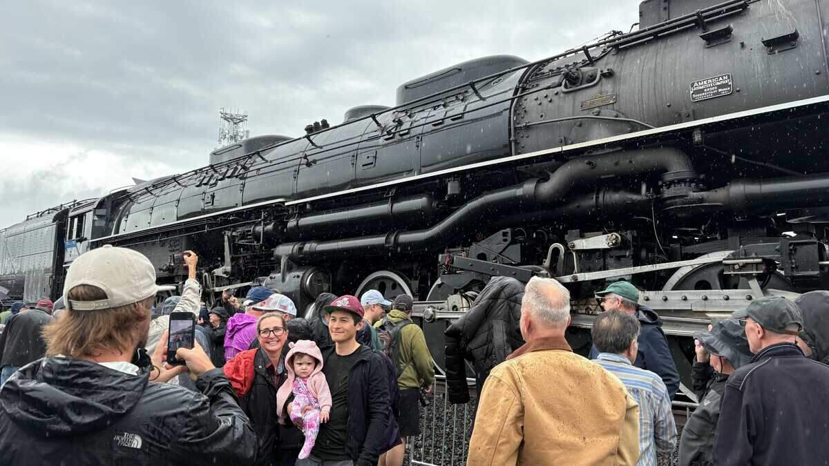 Visitors pose for photos in front of Union Pacific Railroad’s Big Boy No. 4014 in Roseville, California, on Friday, April 10, 2026. The restored steam locomotive is traveling across the country to commemorate the nation’s 250th anniversary and stops in central Pennsylvania this week.