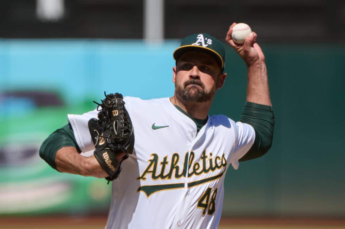 Sep 7, 2024; Oakland, California, USA; Oakland Athletics pitcher T.J. McFarland (48) throws a pitch against the Detroit Tigers during the seventh inning at Oakland-Alameda County Coliseum. Mandatory Credit: Robert Edwards-Imagn Images