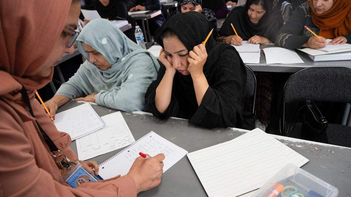 Afghan student Diba Bakhshi Kargar, 28, waits for a paraeducator to check her spelling and grammar during an ESL class in Sacramento County, Calif. Bakhshi Kargar escaped on one of the last planes out of Kabul with her baby and her husband — a Special Immigrant Visa holder — when the Taliban took over Afghanistan.
