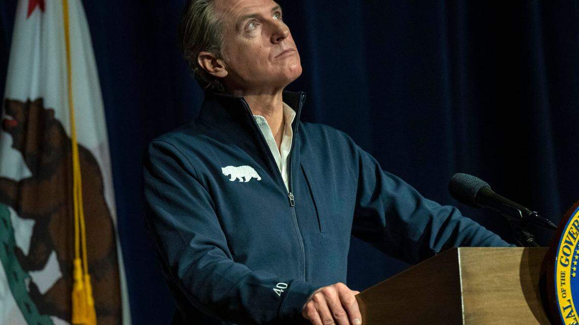 Gov. Gavin Newsom looks up as he listens to a question after he announced his 2023 state budget on Tuesday in Sacramento.