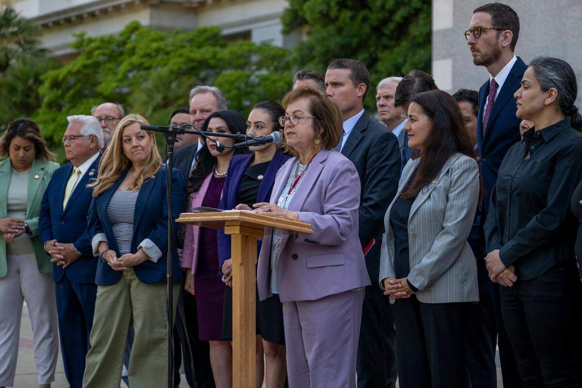 State Sen. María Elena Durazo, D-Los Angeles, and members of the California Senate deliver remarks on the west steps of the state Capitol on Friday in solidarity with ongoing protests in Los Angeles.
