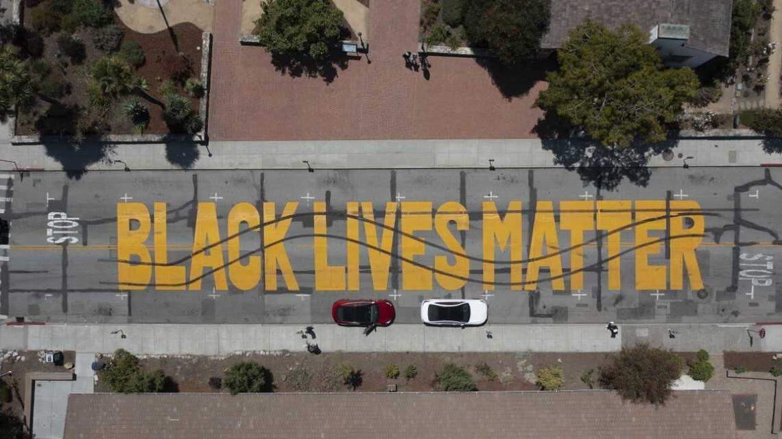 Two men are accused of defacing a Black Lives Matter street mural in Santa Cruz, California.