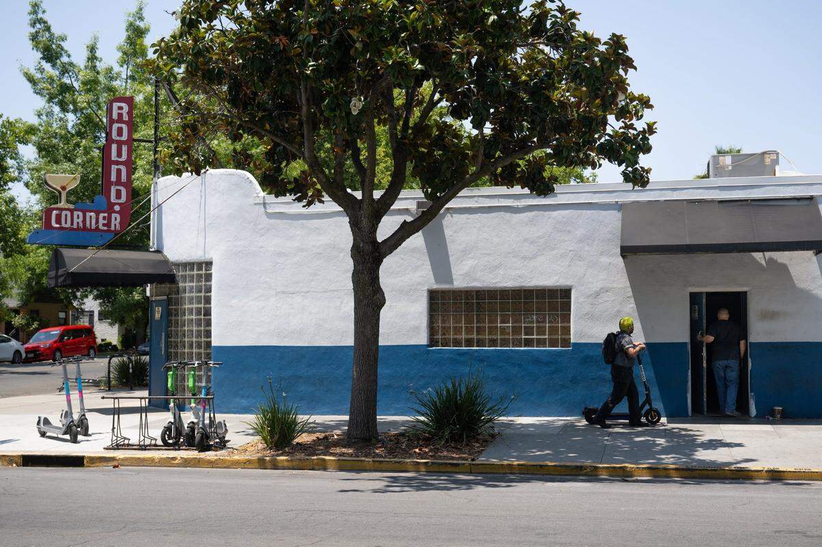 Customers enter the Round Corner Tavern on 24th Street in Sacramento on June 6, 2025. The bar has been sued over Americans with Disabilities Act violations.