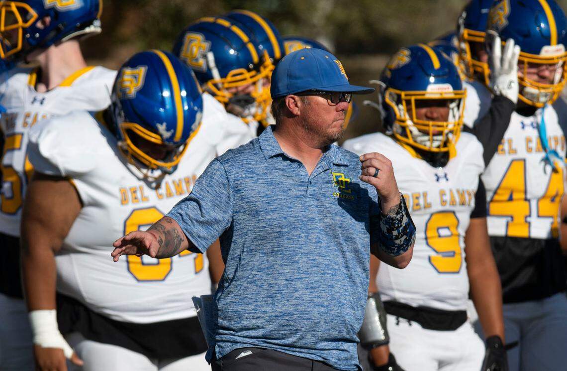 Del Campo coach Matt Costa signals to his players in the first half of a Sac-Joaquin Section first-round playoff game against the Sacramento Dragons on Saturday, Nov. 9, 2024.
