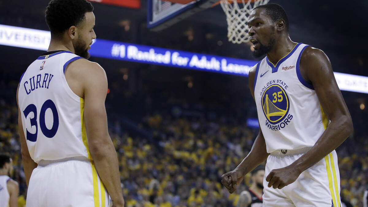 Golden State’s Kevin Durant, right, could rejoin Stephen Curry and his Warriors teammates in their NBA Finals series with the Toronto Raptors.