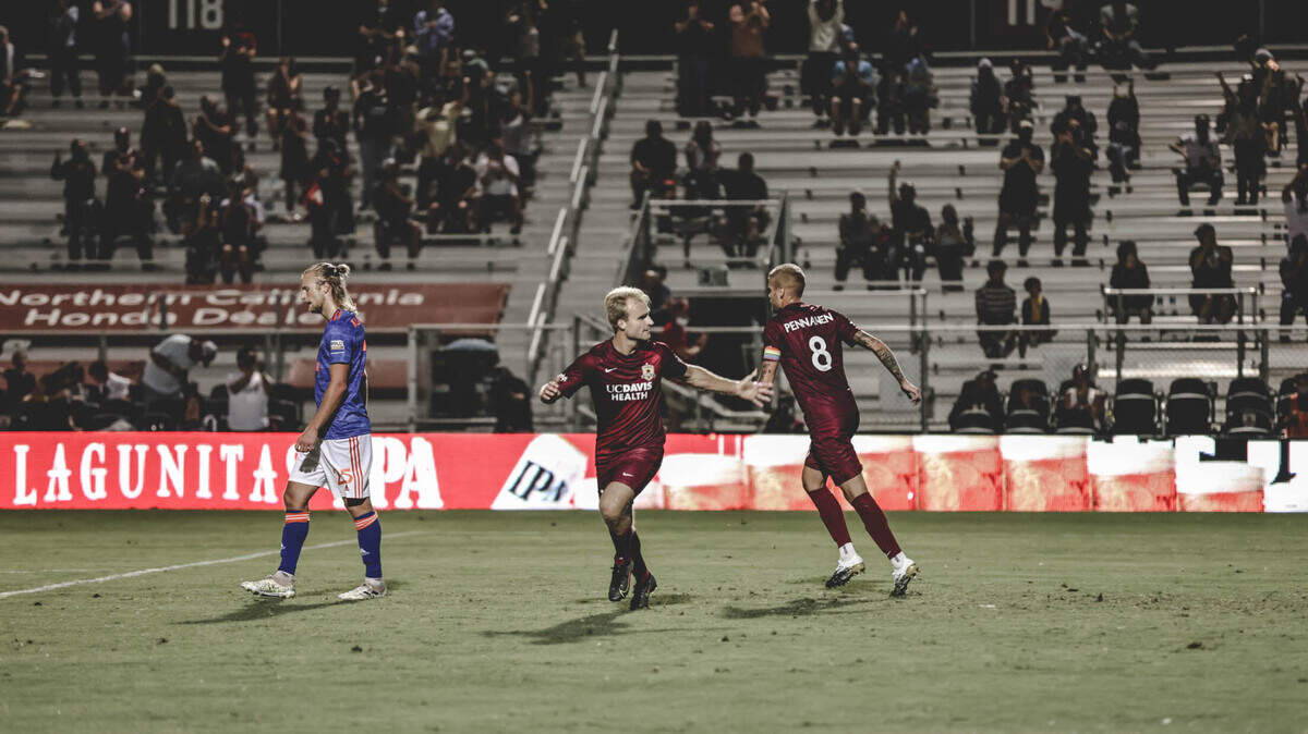 Sacramento’s Tucker Bone celebrates after scoring in the second half against Orange County on Saturday night.
