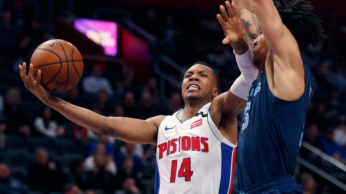 Detroit Pistons forward Louis King (14) is defended by Memphis Grizzlies forward Brandon Clarke during the second half of an NBA basketball game, Friday, Jan. 24, 2020, in Detroit. (AP Photo/Carlos Osorio)
