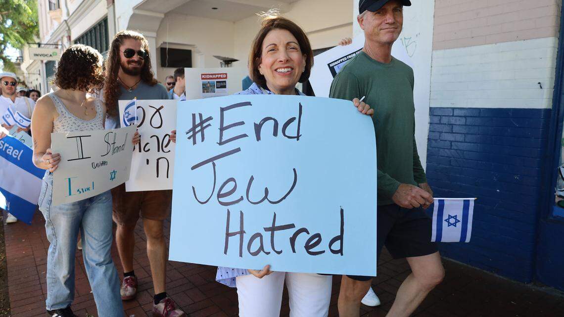 A woman holds a sign that reads “End Jew Hatred” during a community march to show support for Israel led by Jewish students from UC Santa Barbara on Oct. 22 in downtown Santa Barbara. 