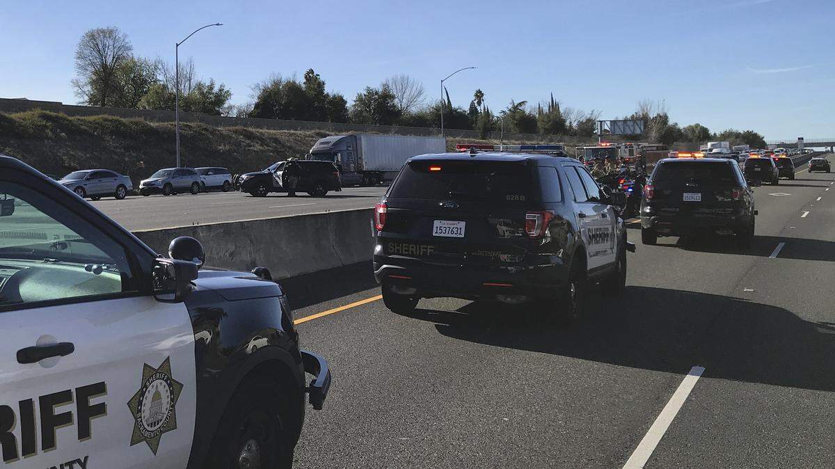 Sacramento County Sheriff’s Department respond to a shooting on eastbound U.S. Highway 50 near the Mather Field Road exit where a woman sustained a gunshot wound to her upper body, Friday, December 28, 2018.