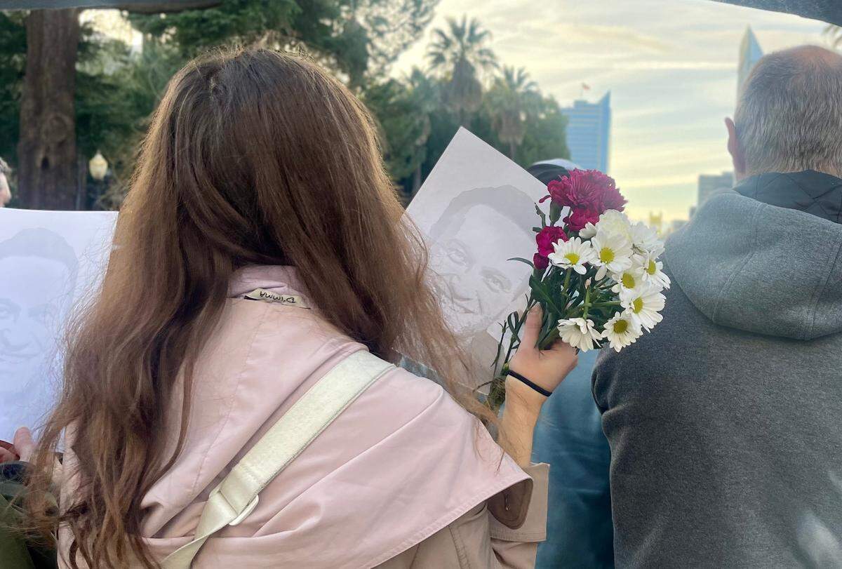 Members of The Voices of Russian Opposition in Sacramento gather at the California Capitol on Sunday, Feb. 16, 2025 to commemorate the anniversary of the death of Russian opposition leader Alexei Navalny.