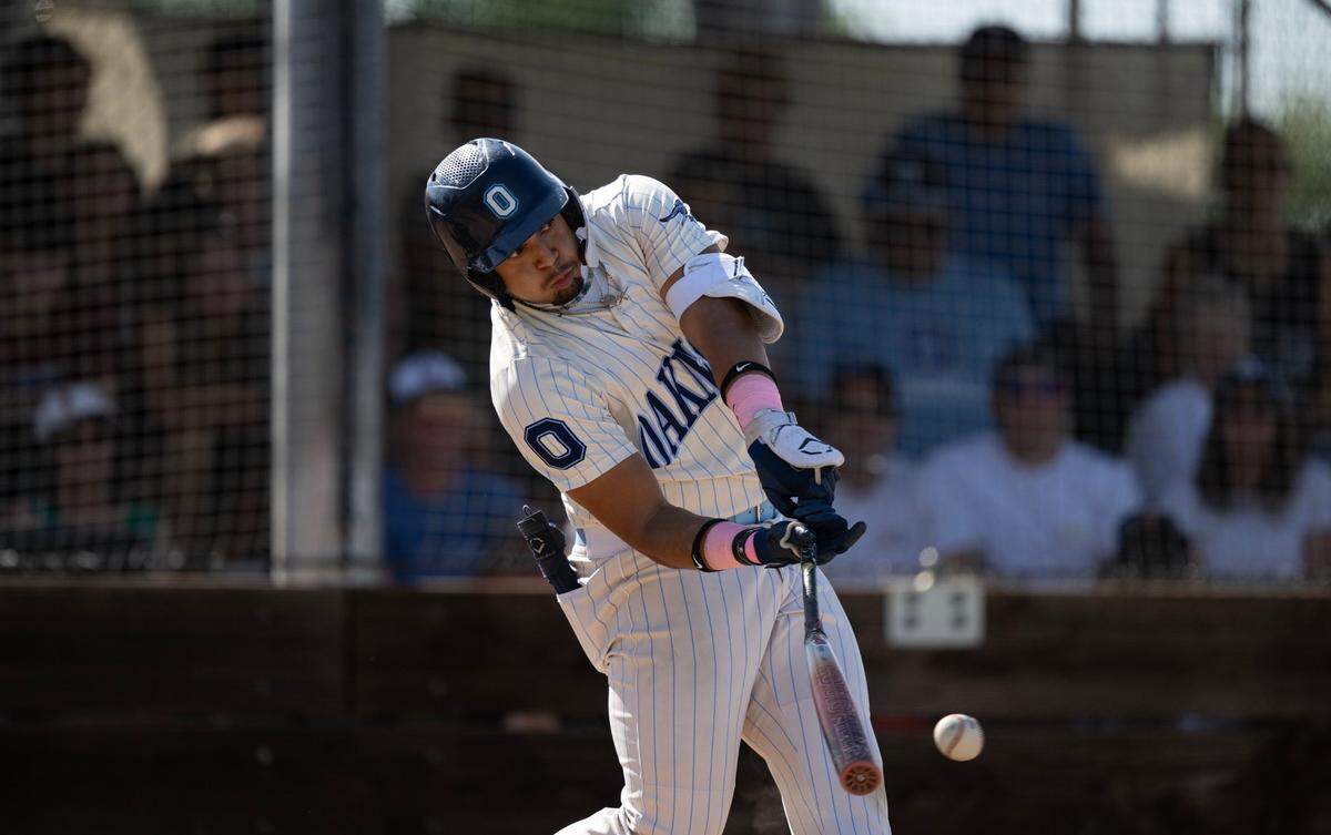Oakmont batter Tony Lira (24) singles in the bottom of the fourth inning, scoring the team’s first run in the CIF NorCal Baseball Division lll semifinal game against Christopher High School of Gilroy on May 30 in Roseville.