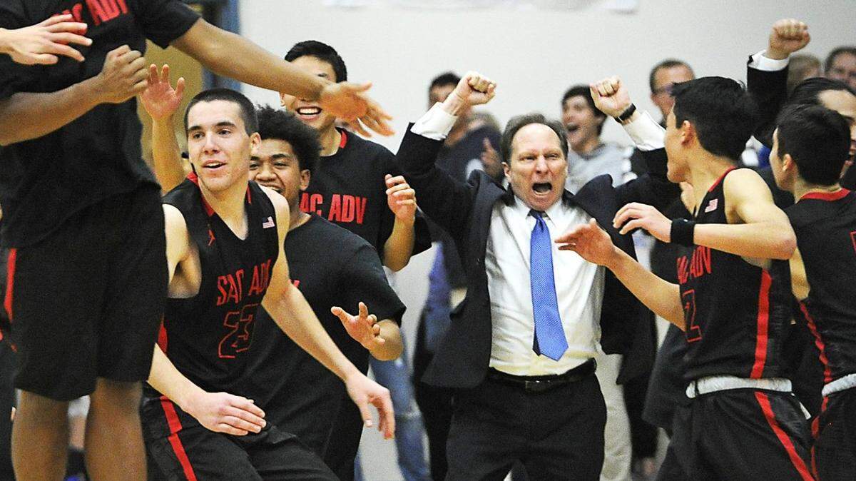 Sacramento Adventist players and coach Scott Tedmon celebrate their 57-47 victory over Ripon Christian during the CIF State Northern California Division VI final game at Ripon Christian High School in 2018. Tedmon, a Sacramento Superior Court judge, retired from coaching in 2021 but is returning Monday to coach Sac Adventists’ girls basketball team.