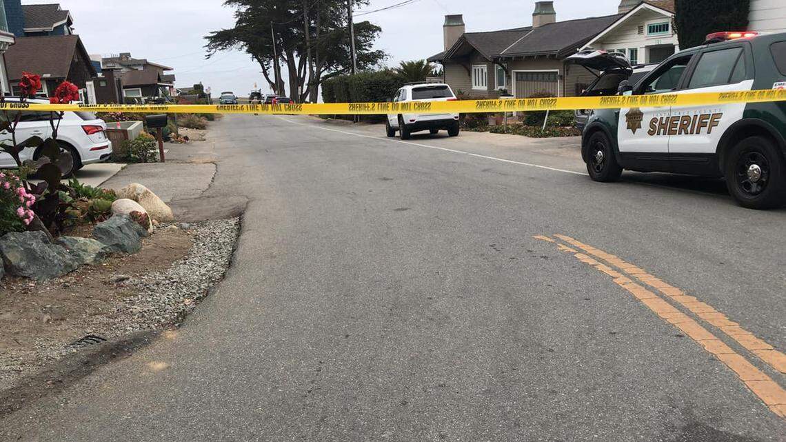 A vehicle with three passengers drove off a cliff at Sunny Beach Cove in Santa Cruz, California, on Sept. 17, 2021. A surfer in the water spotted the crash and rescued the two children and one adult, officials said.