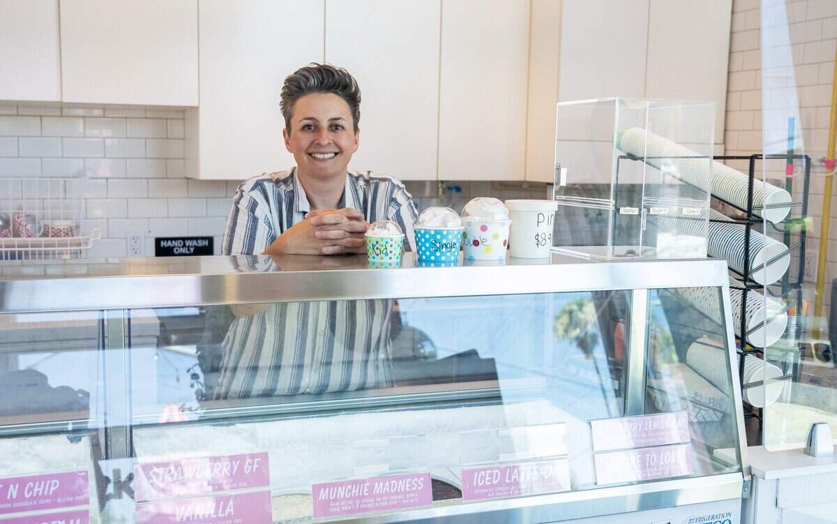 Susan Stewart, owner of Licked, stands behind the counter of her ice cream shop located in Sacramento’s Oak Park neighborhood on Thursday, June 11, 2026.