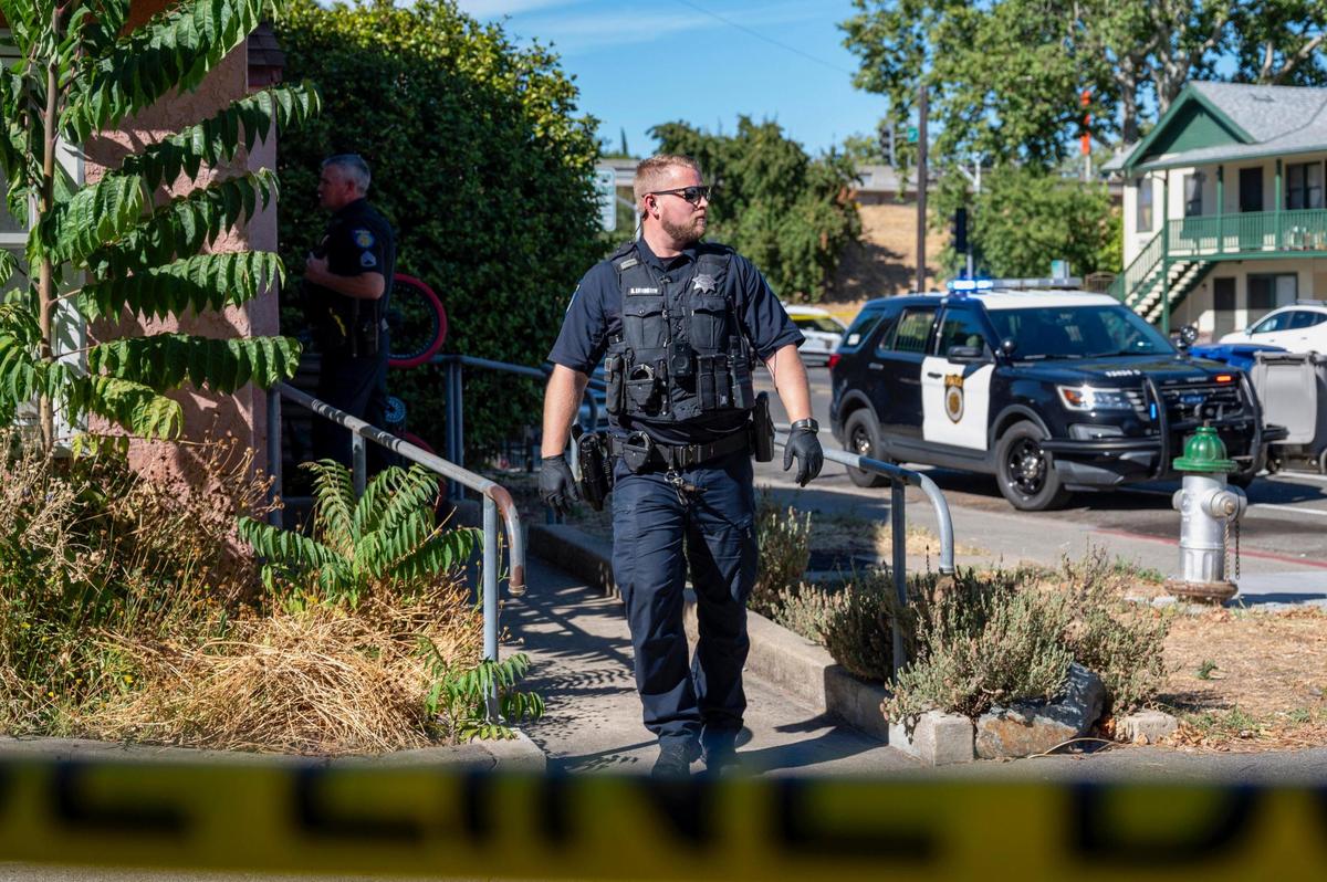 Police canvas the Curtis Park neighborhood for witnesses after a man was wounded in a shooting reported Monday afternoon on Monday near 24th and X streets in Sacramento.
