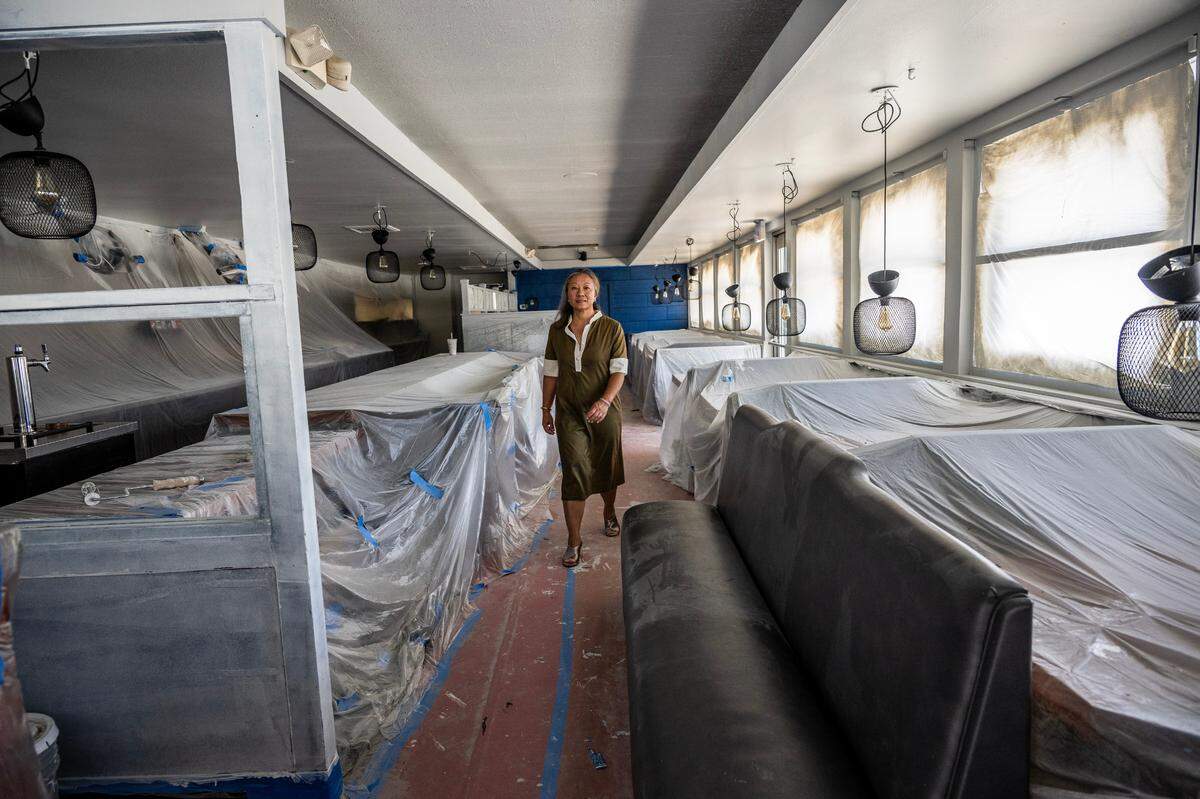 Kathy Chao Rothberg, CEO at Lao Family Community Development, walks through the restaurant of the former Vagabond Inn as she gets ready for the launch of her organization’s CARE Campus Sacramento in 2023.