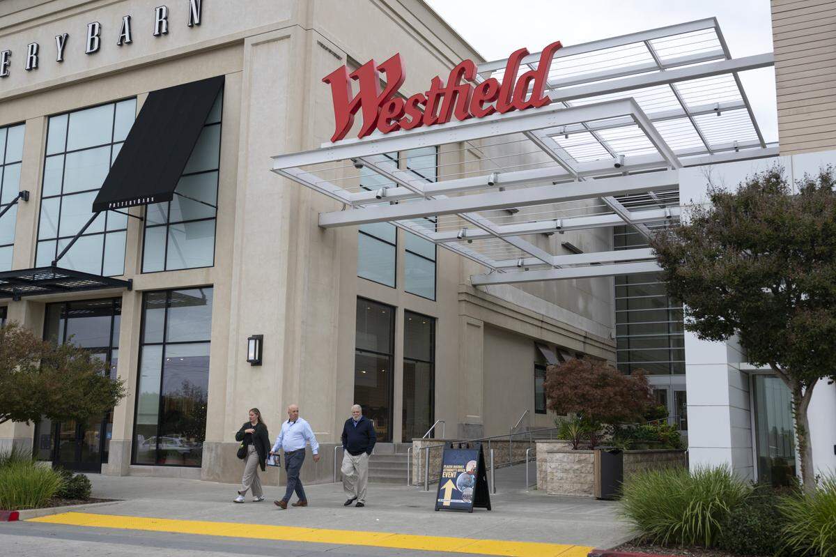 Shoppers exit the Roseville Galleria on Wednesday.
